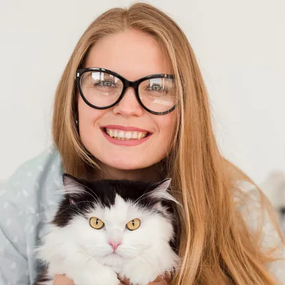 A woman holding her cat